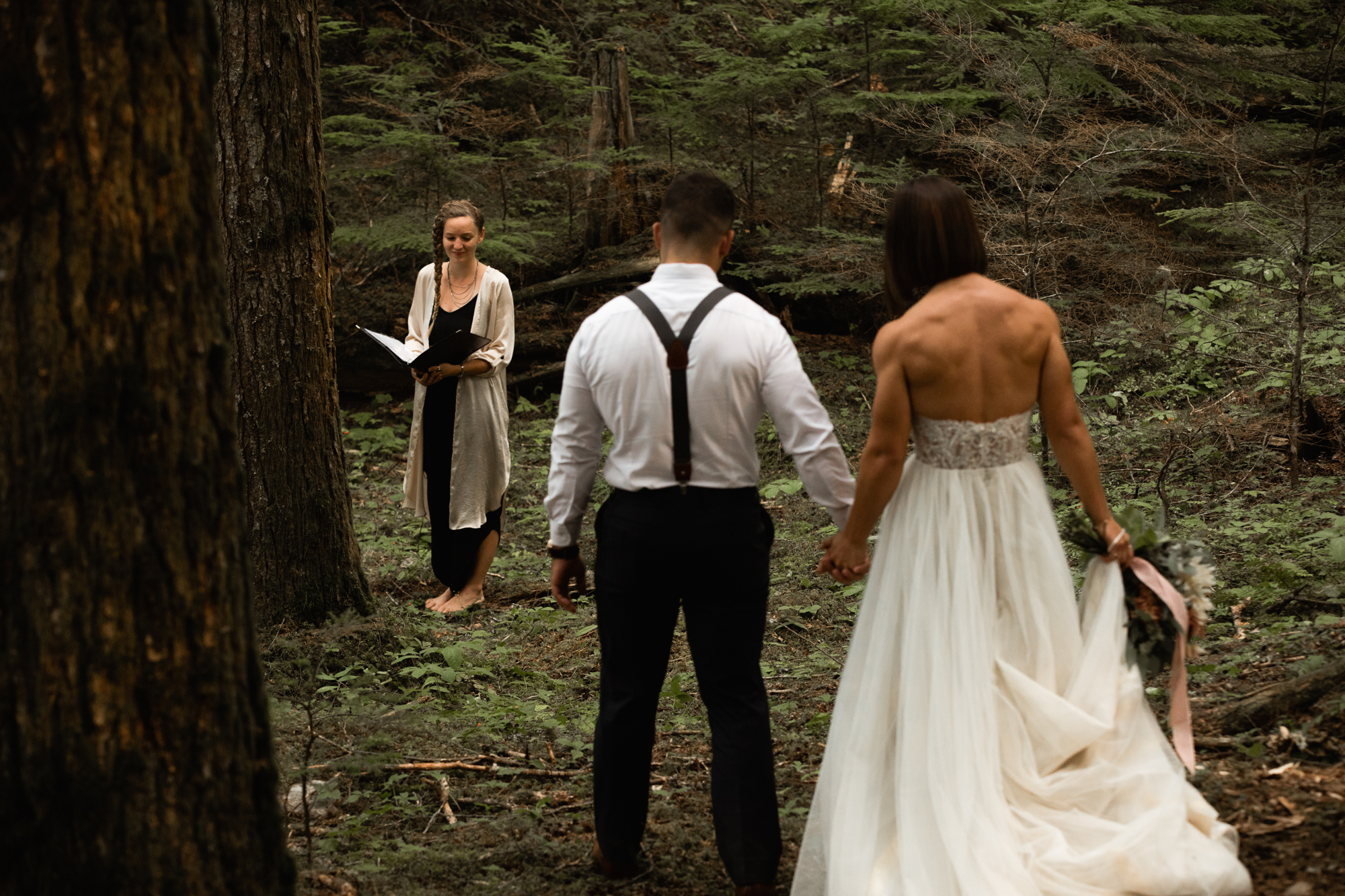 bride and groom walking to elopement ceremony