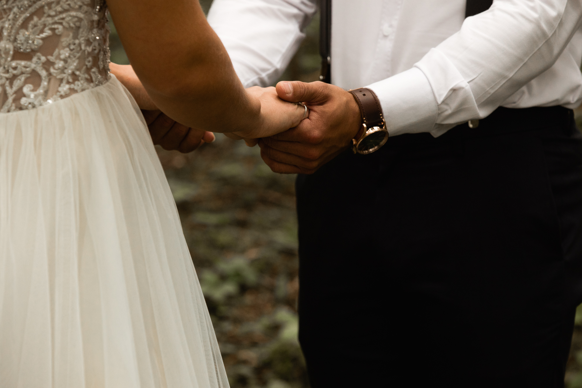 bride and groom holding hands