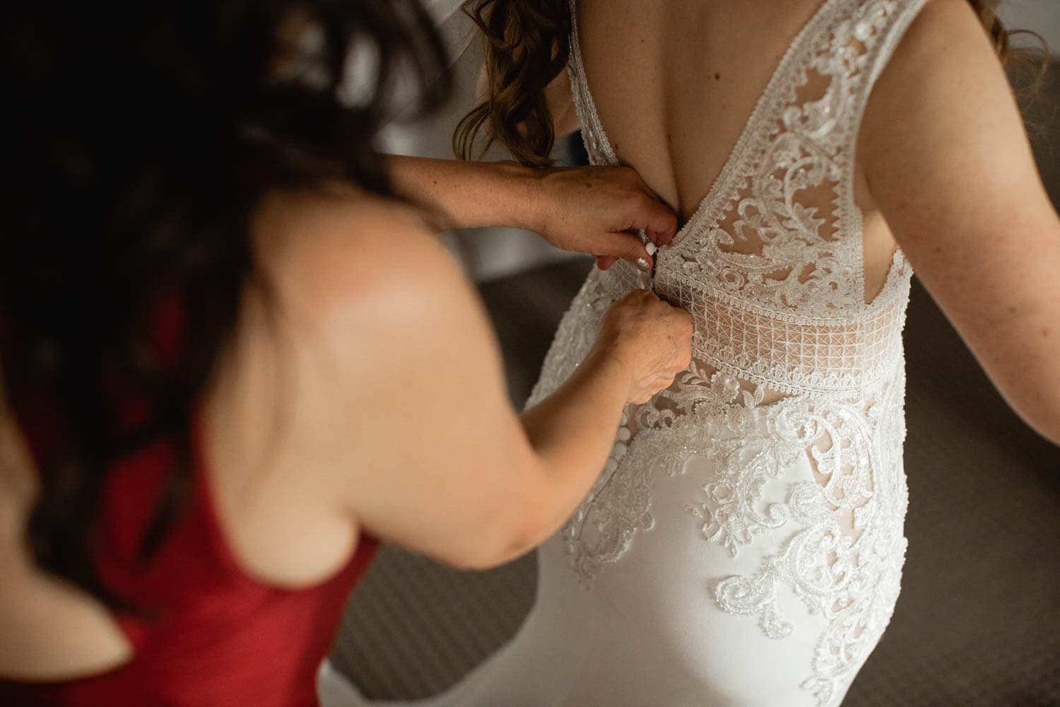 bride putting dress on