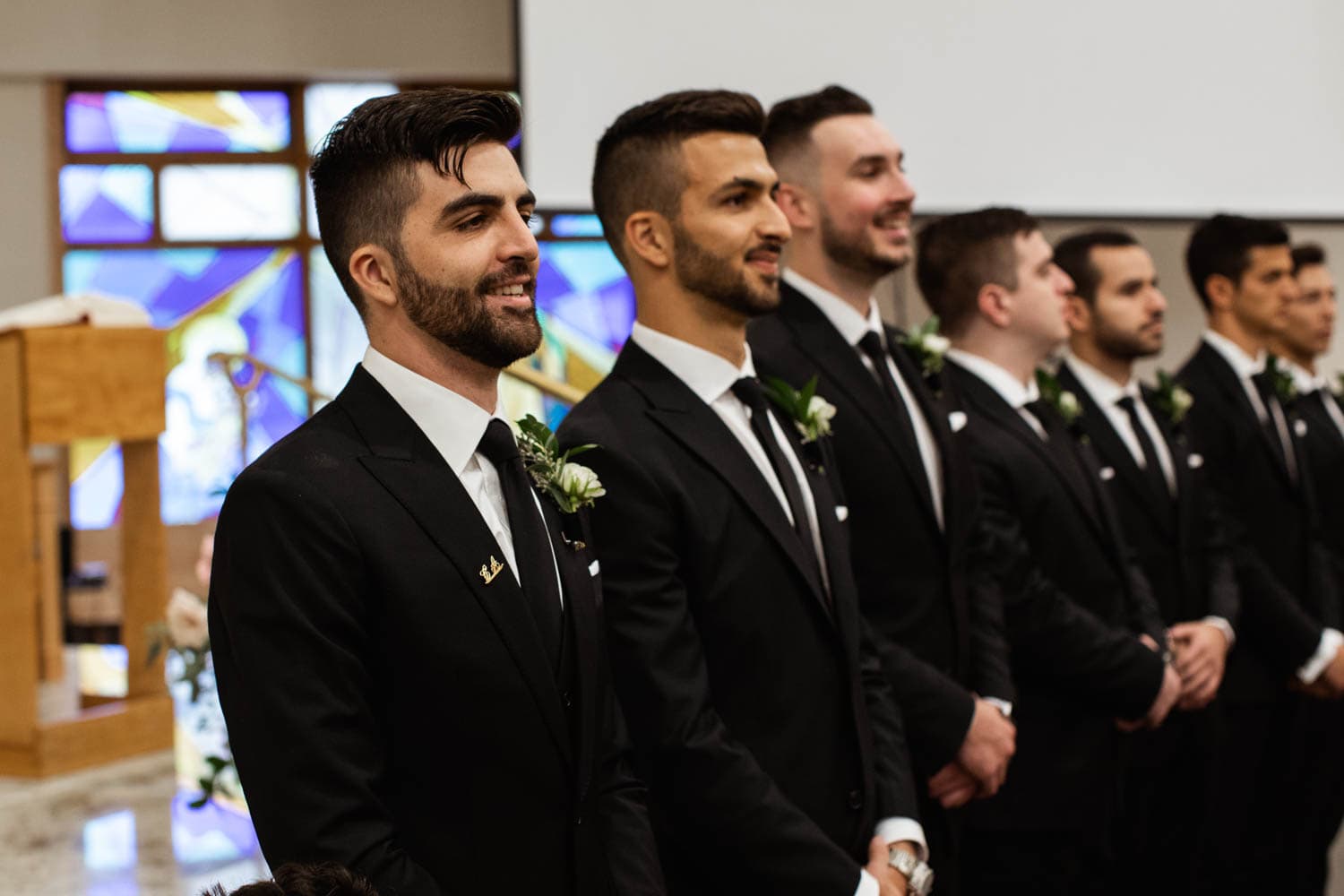 groomsmen at the alter