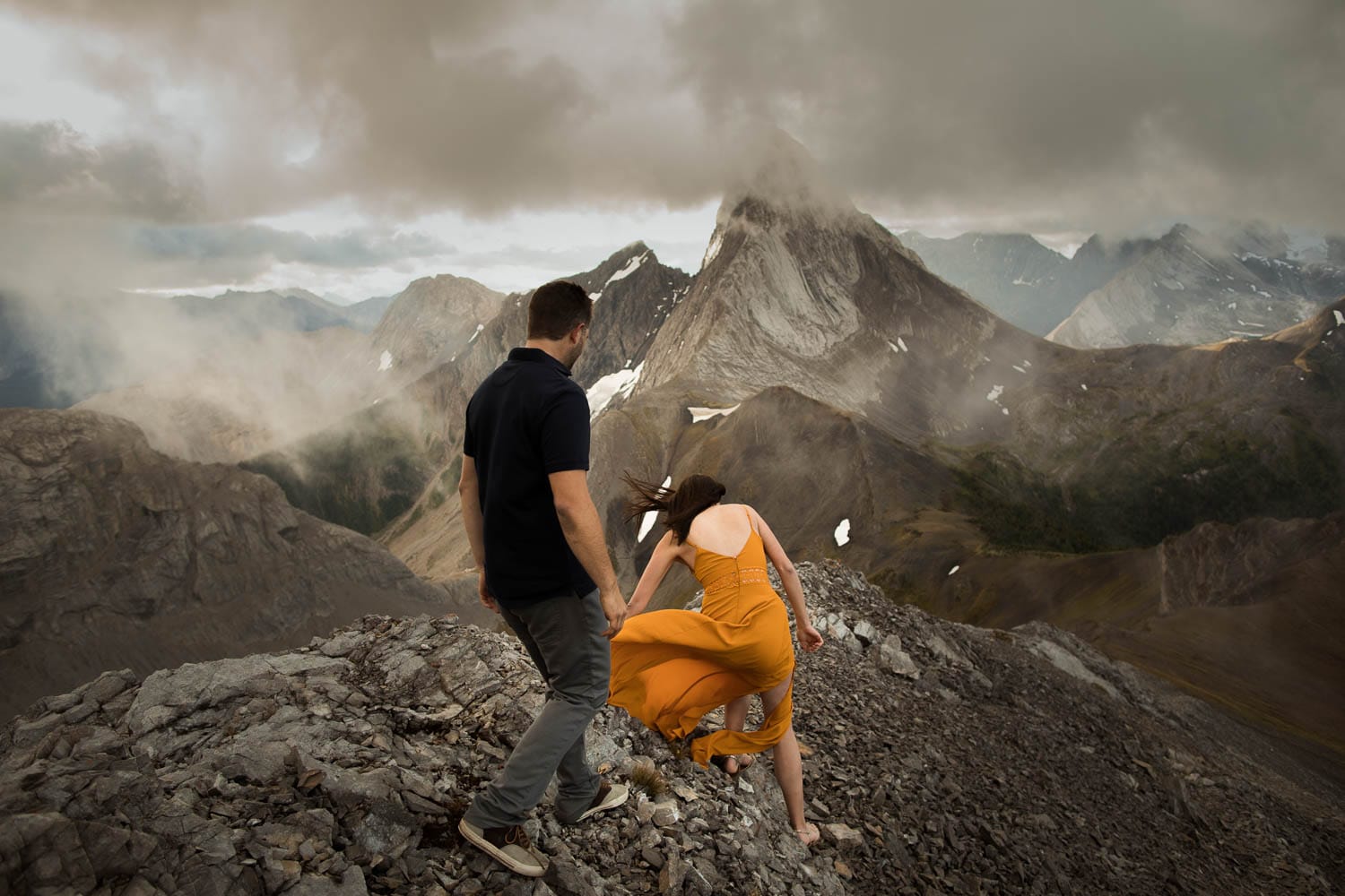 couple hiking up mountain