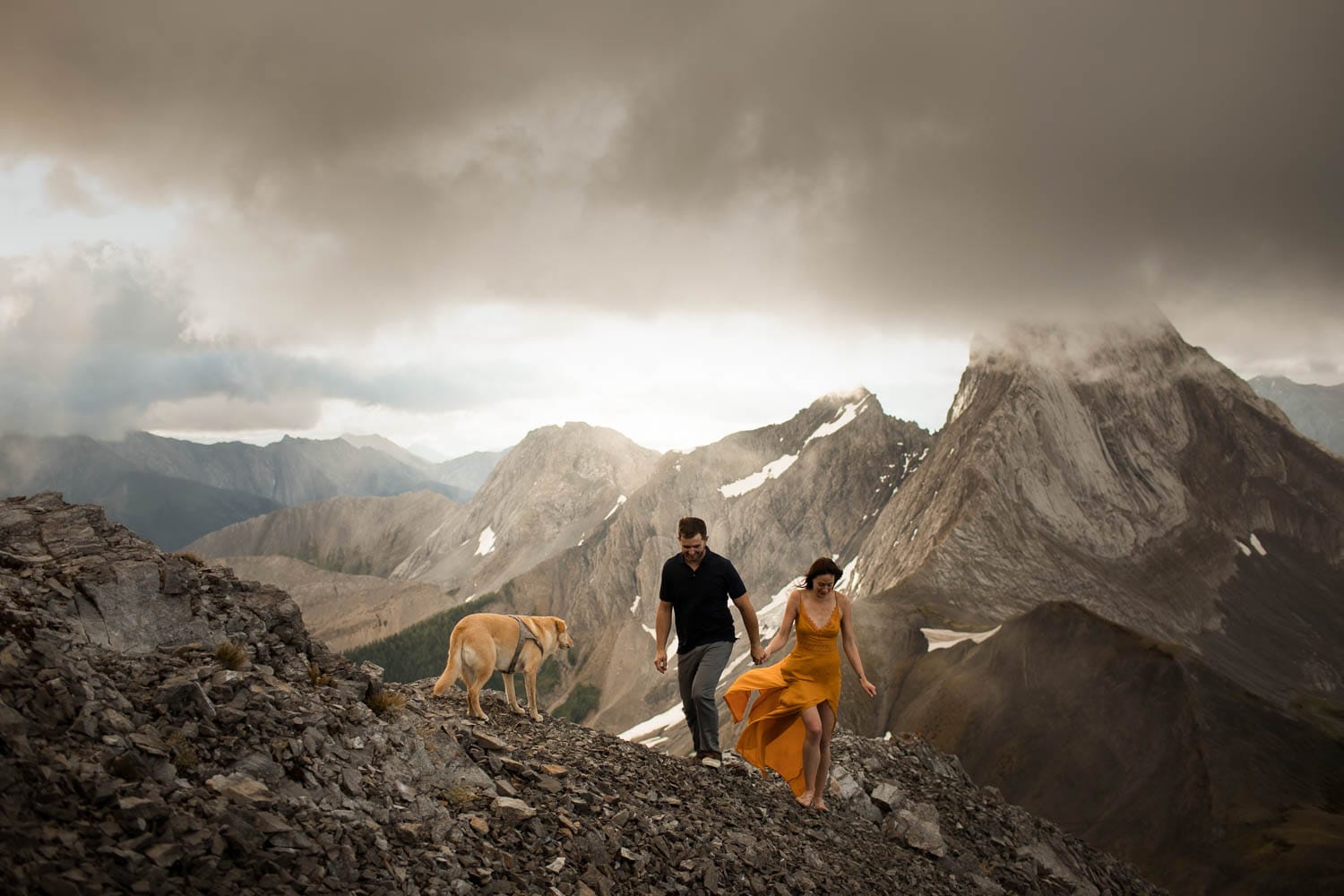 engagement shoot on a  mountain with a dog