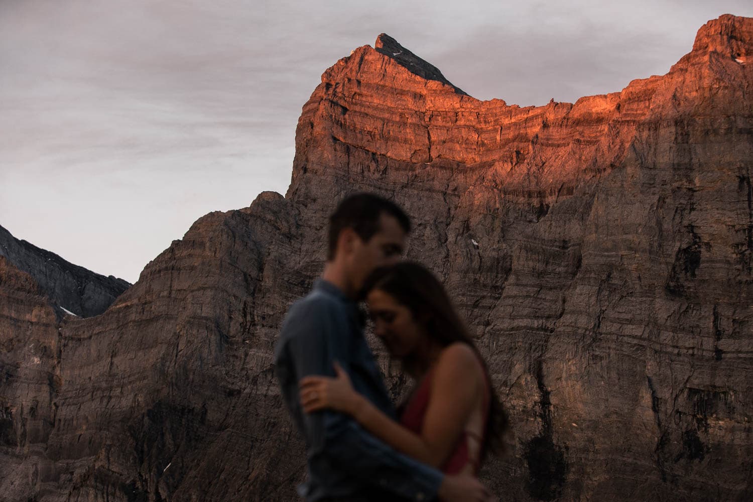 Couple at sunrise in the mountains