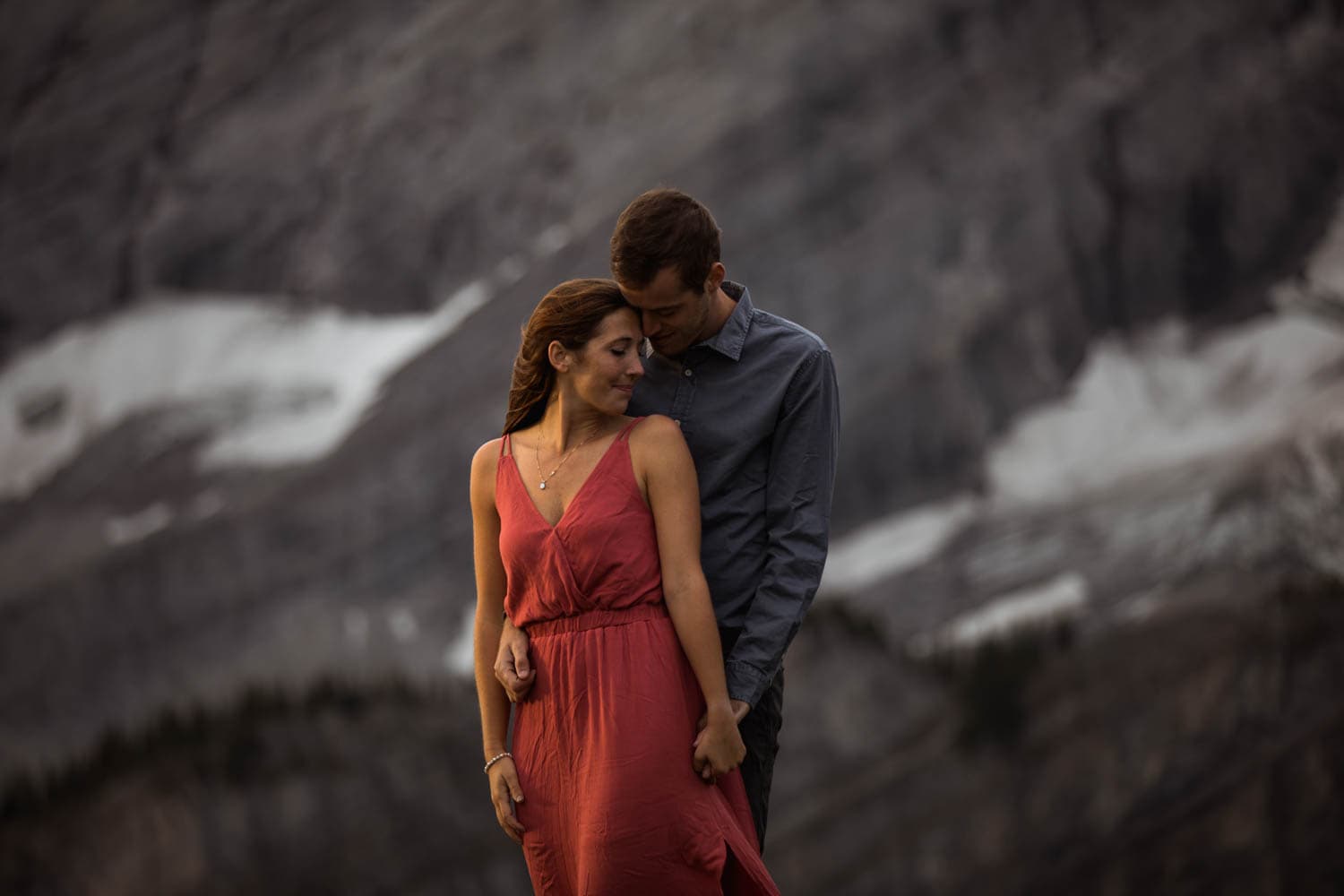 Couple at sunrise in the mountains