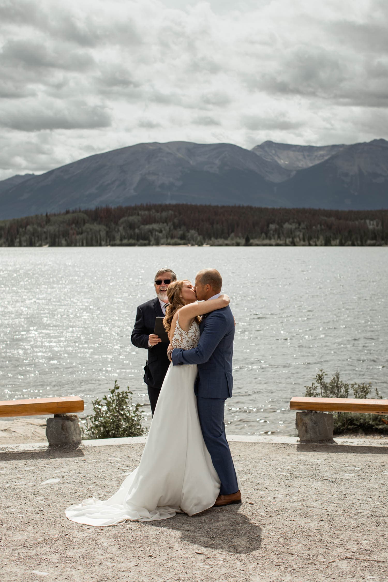 bride and groom first kiss