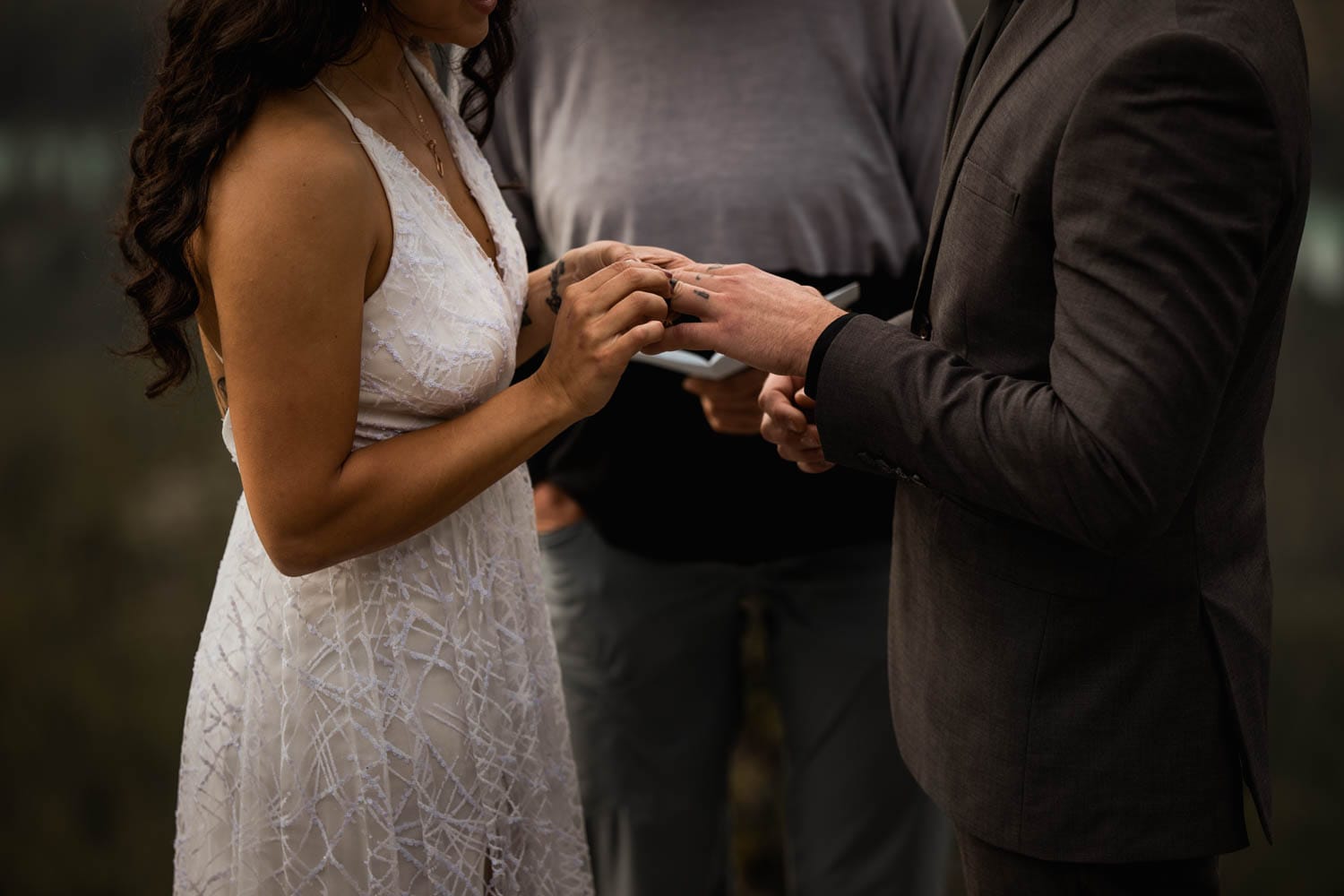 exchanging rings on top of mountain