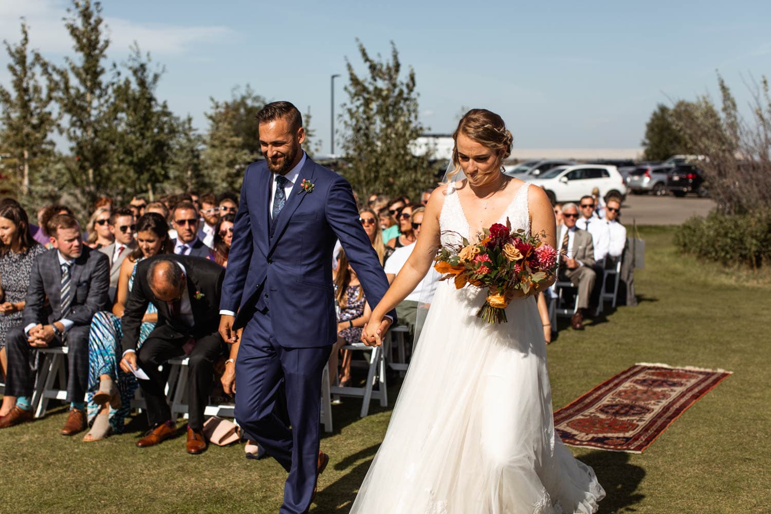 bride and groom walking down aisle