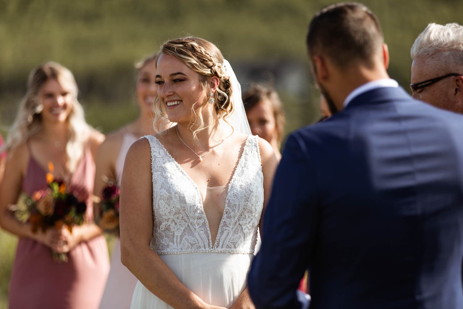 bride laughing at wedding ceremony