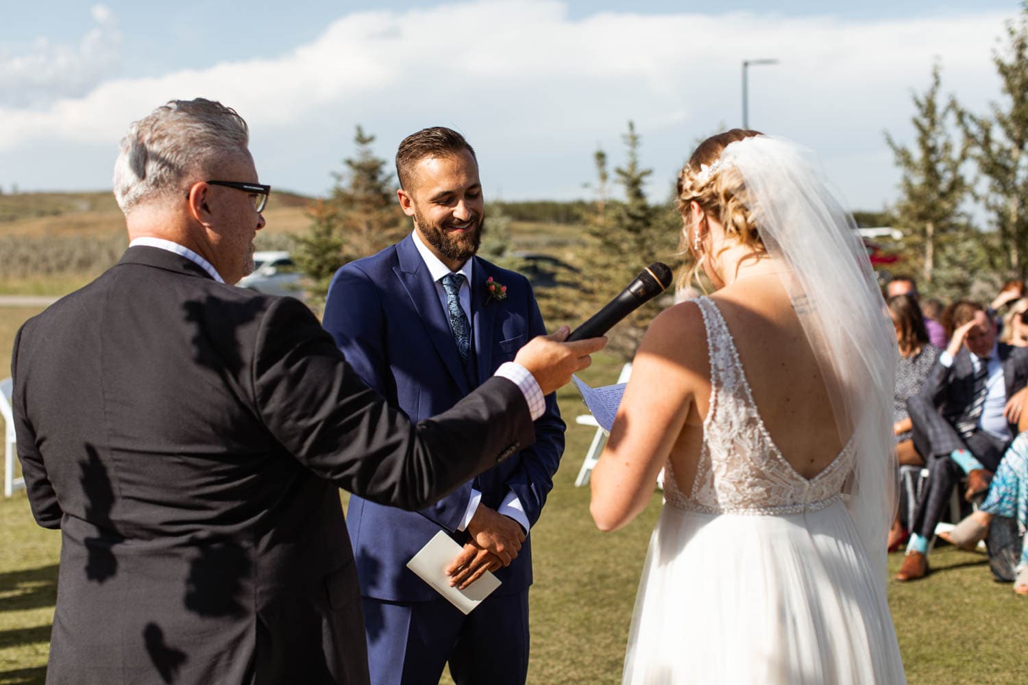 bride giving vows at wedding ceremony