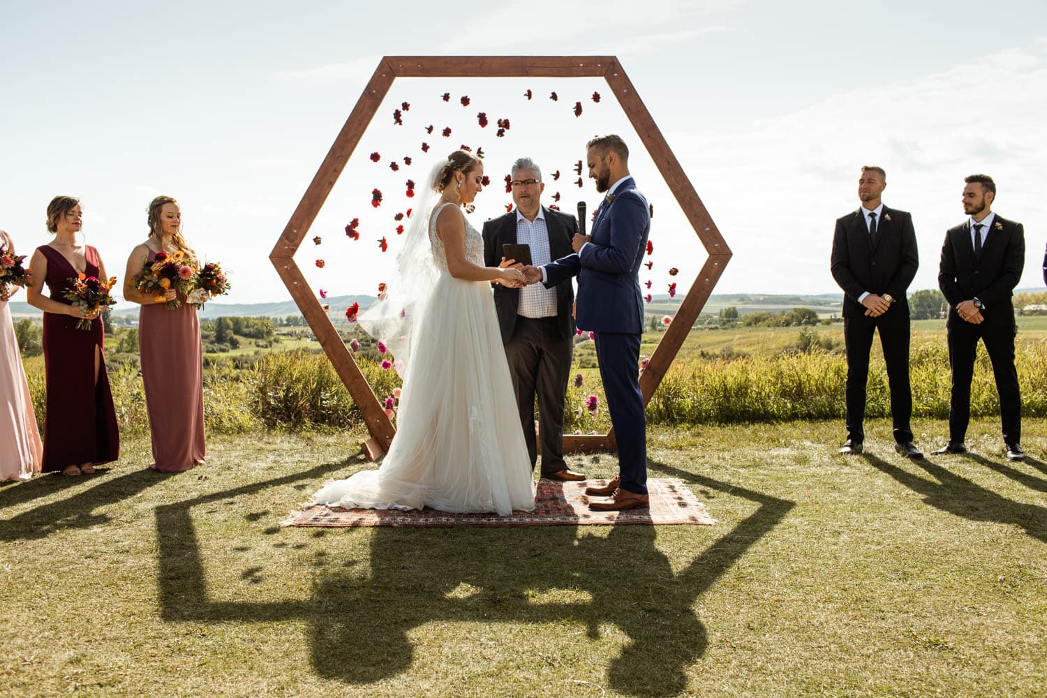 bride and groom exchanging rings at wedding ceremony