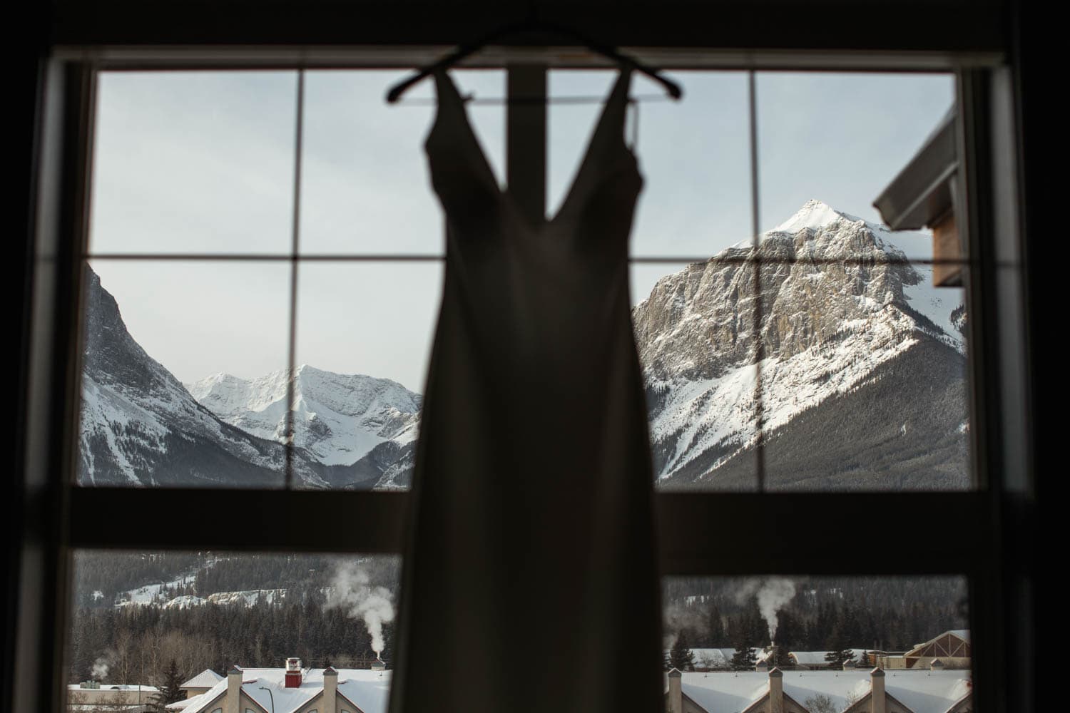 brides dress in front of mountains