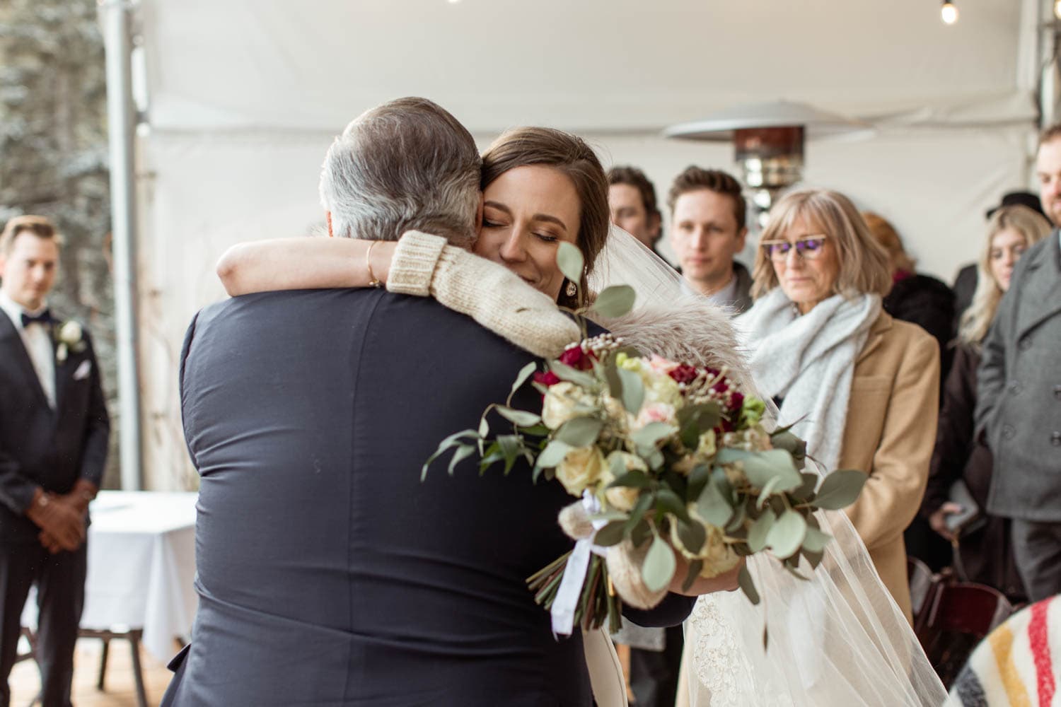 Bride hugging father